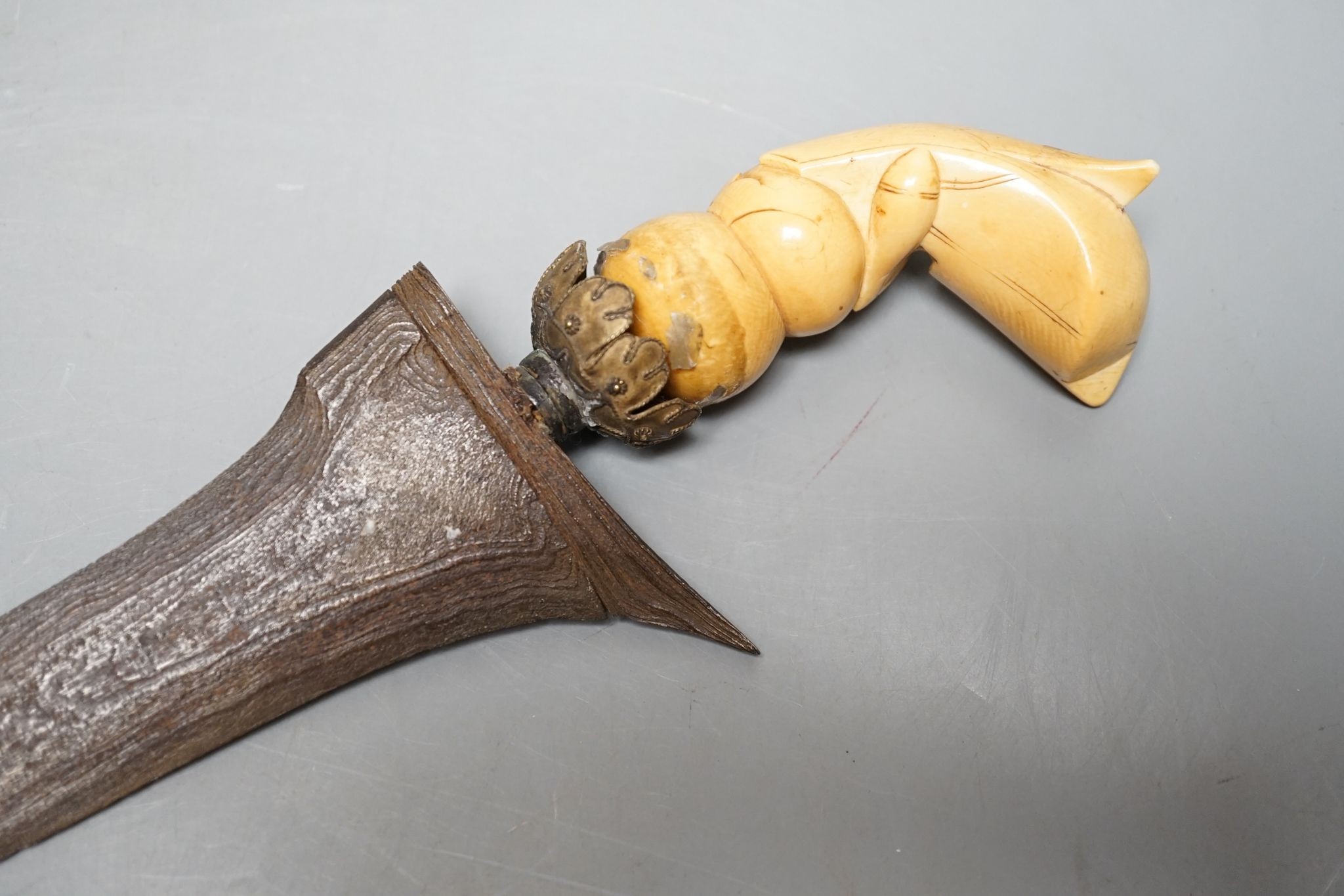 A 19th century ivory handled Kris, 40 cms long.